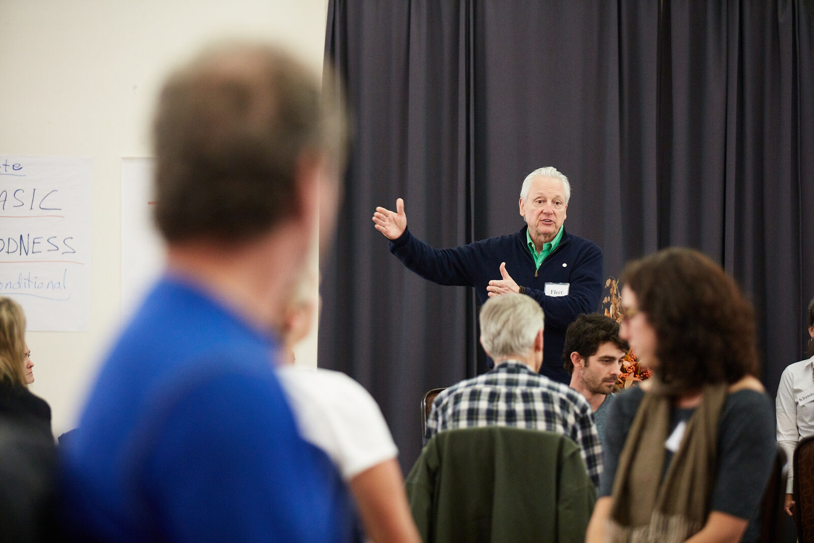 Fleet Maull teaching, gesturing to a seated room of participants